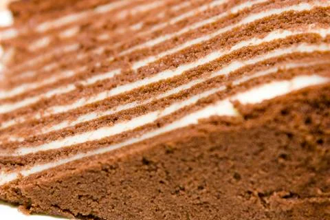 Puff chocolate sponge cake with nuts Chocolate puff cake. Stock Photos