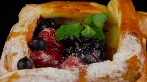 Puff pastry with berries rotating, closeup (loop) Stock Footage 55641773