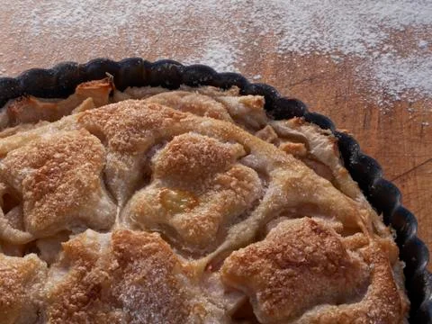 A puff pastry covered lightly sugared apple tart Stock Photos
