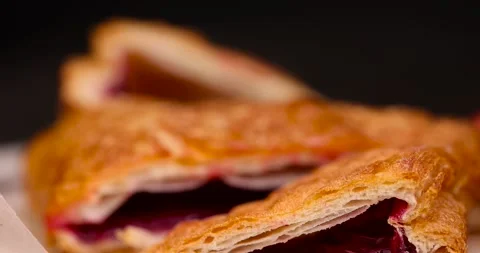 Puff pastry with red strawberries, a puff pastry bun with strawberry and cherry Stock Footage 305665929