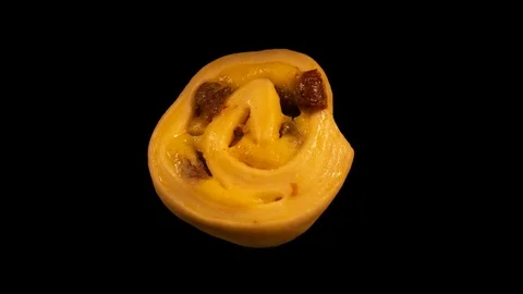 Puff pastry rolls with raisins, baking timelapse, isolated on black background Stock Footage 105394862