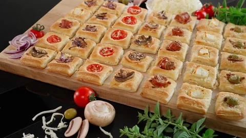 Puff pastry snacks small squares Stock Footage 255408506