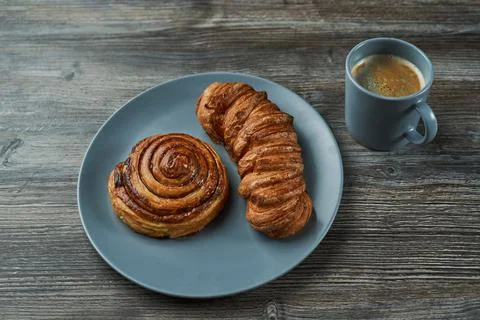 Puff pastry. two buns of different shapes on a plate. one round the other  Stock Photos