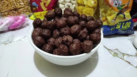 Puffed brown maca balls. Snack from Peru 動画素材 284644665