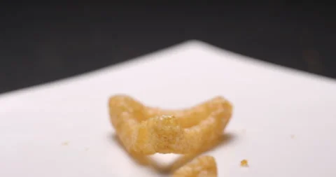 Puffed chips with paprika flavor falling slow motion Stock Footage 280520003