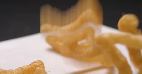 Puffed chips with paprika flavor falling slow motion Stock Footage 280520047
