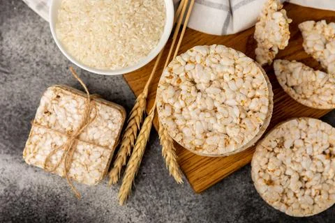 Puffed rice bread on black texture background. Stock Photos