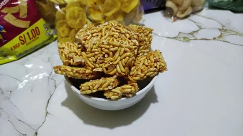 Puffed rice with sweet coating. Snacks in Peru Stock Footage 284645089