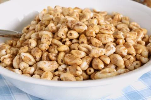 Puffed wheat cereal Stock Photos