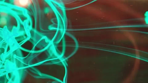 Puffs of multi-colored liquid ink paint flow in the liquid. Stock Footage 193445582