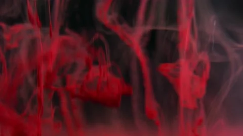 Puffs of multi-colored liquid ink paint flow in the liquid. Stock Footage 193458033