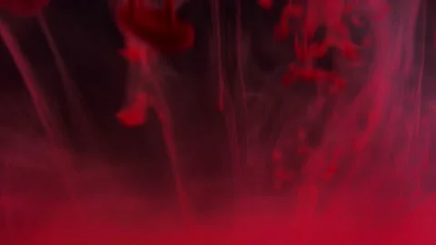 Puffs of multi-colored liquid ink paint flow in the liquid. Stock Footage 193460469