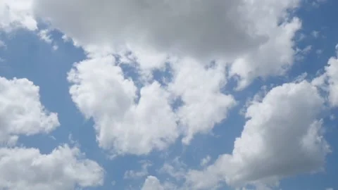 Puffy cloud on clear blue sky time lapse Stock Footage 155924401