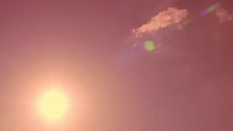 Puffy Cloud Covering Brightly Shining Sun in Coral Pink Sky at Dawn, Beautiful T Stock Footage 171219984