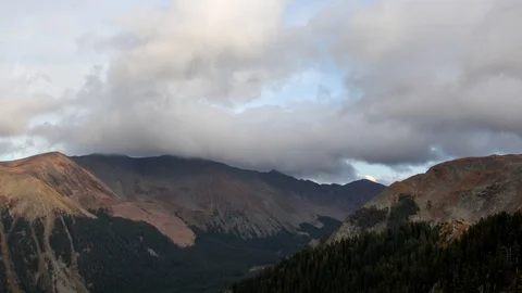 Puffy clouds above bald mountain time lapse Stock Footage 98579280