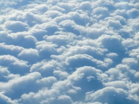 Puffy clouds background Stock Photos