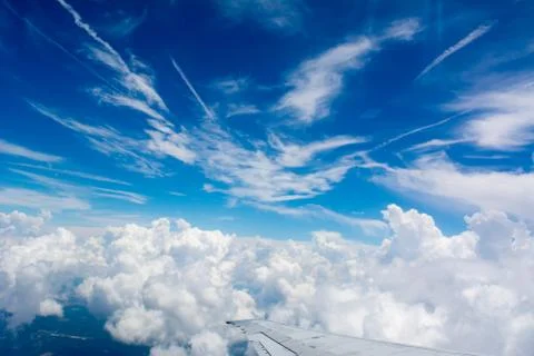 Puffy Clouds on Blue Sky Background Stock Photos