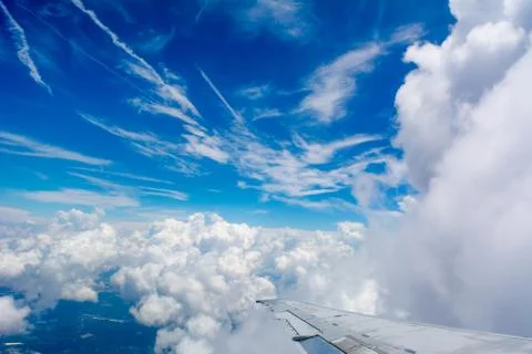 Puffy Clouds on Blue Sky Background 库存照片