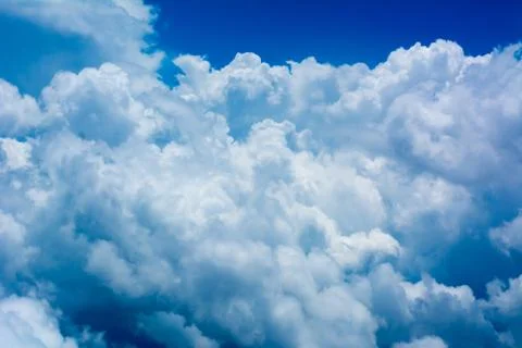 Puffy Clouds on Blue Sky Background Stockfoto's