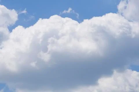 Puffy clouds on blue sky Stock Photos