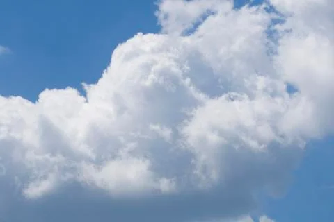 Puffy clouds on blue sky Stock-Fotos