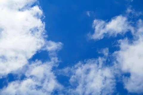 Puffy clouds on blue sky Stock-Fotos