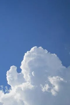 Puffy clouds on blue sky Stock Photos