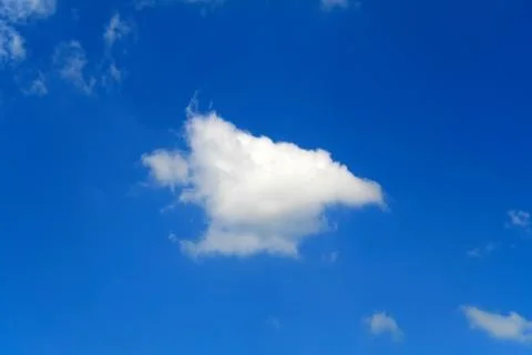 Puffy clouds on blue sky Stock Photos