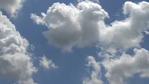 Puffy clouds on a clear blue sky Stock Footage 159079319