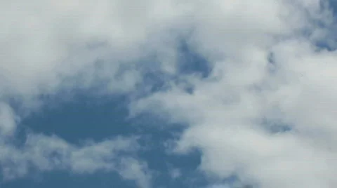 Puffy clouds moving fast Stock Footage 447029