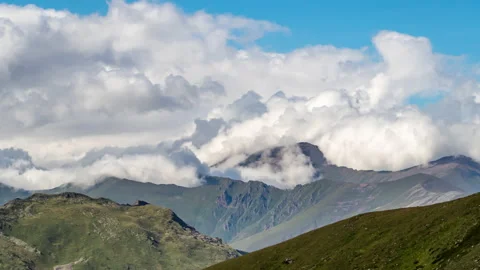 Puffy clouds over the mountains. Stock Footage 157164153