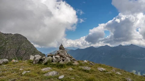 Puffy clouds over the mountains. 動画素材 194765078