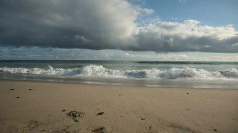 Puffy Clouds over Ocean and Beach Stock Footage 447584