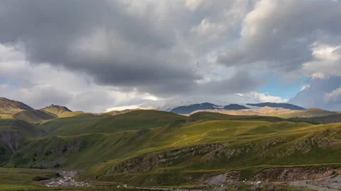 Puffy clouds over the snowy mountain pick. 動画素材 171960536