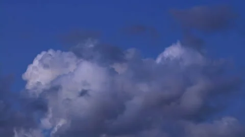 Puffy cumulus clouds swirl at sunset . Time lapse, relaxation dramatic beauty of Stock Footage 162800448