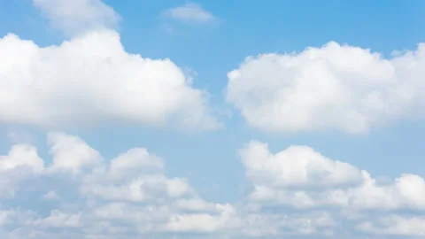 Puffy fluffy beautiful white clouds on blue sky.Cloudscape timelapse. Stock Footage 144883706