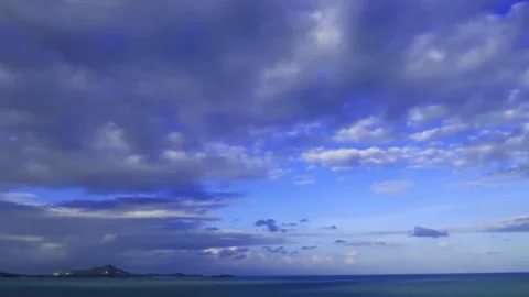 Puffy fluffy cumulus cloudscape over calm sea water n ocean wave Stock Footage 146899535