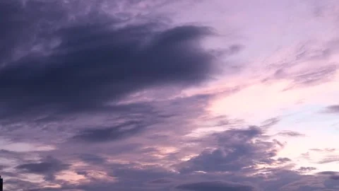 Puffy fluffy pink clouds fly away and remain pure sunset lilac sky cloudless Stock Footage 316045642