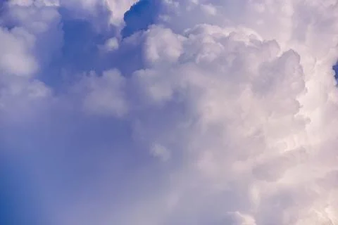 Puffy fluffy white clouds against daytime sky. Stock Photos