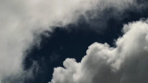 Puffy fluffy white clouds blue sky time lapse motion background. Stock Footage 100179876