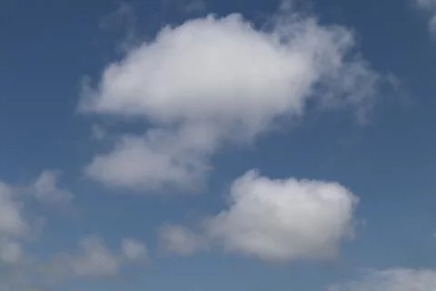 Puffy fluffy white clouds Stock Photos