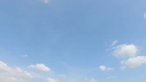 Puffy fluffy white cumulus clouds on beautiful sunny clear sky background Stock Footage 147113742