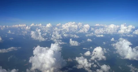Puffy Popcorn Clouds from Airplane Window. 4k DCI footage Stock Footage 82403323