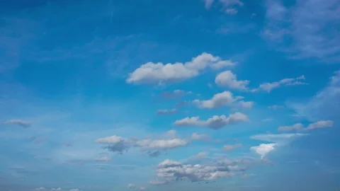 Puffy Rolling White Clouds on a Blue Sky 4k Timelapse 動画素材 79109634