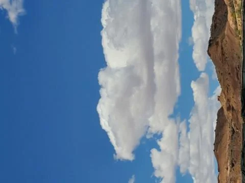 Puffy White Clouds in Blue Sky Stock Photos