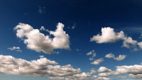 Puffy white clouds clearing after rain  - Real Time Stock Footage 100743181