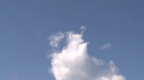 Puffy white clouds over a sandy shoreline (2 of 6) Stock Footage 10785941