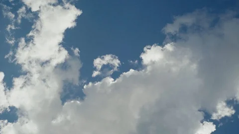 Puffy White Clouds in the sky - Blue Bird Day Stock Footage 90396669