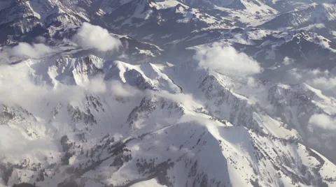 PuffyCloudsAboveSnowCoveredMountains -0018 Stock Footage 64723543