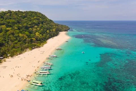 Puka Shell Beach. Wide tropical beach with white sand. Beautiful white beach and Stock Photos